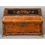 A Victorian marquetry inlaid burr walnut tea caddy
The hinged rectangular top centred with a