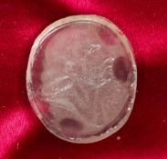 A carved glass intaglio
Of oval form, with a male bust, possibly signed Berry F; together with a