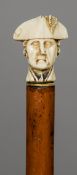 A 19th century malacca cane
The ivory pommel carved as a bust of Nelson.  90 cm long. CONDITION
