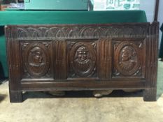 An 18th century coffer panel
With Romaine carved busts.  126.5 cm wide. CONDITION REPORTS: Some