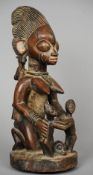 An African carved hardwood tribal fetish figure
With traces of painted decoration.  45 cm high.