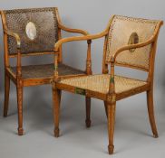 A pair of 19th century painted satinwood caned open armchairs
Each 54 cm wide.  (2) CONDITION