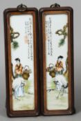 A pair of Chinese porcelain sleeve panels
Each decorated with a figure holding a basket of flowers