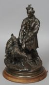 A 19th century bronze figural group of a huntsmen and hounds
50 cm high. CONDITION REPORTS: