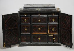 An 18th century ebony spice cabinet
The interior with an arrangement of geometrically inlaid