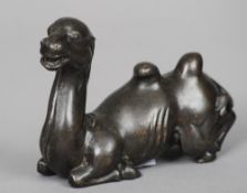 A Chinese patinated bronze scroll weight
Formed as a recumbent camel.  13 cm wide. CONDITION