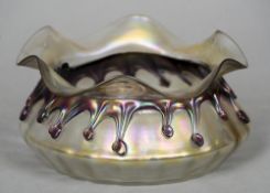 An early 20th century Loetz type iridescent Art Glass bowl
Of squat crimped form. 19.5 cm