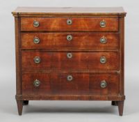 A 19th century Continental mahogany chest of drawers
The crossbanded canted rectangular top above