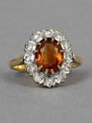 An 18 ct gold diamond citrine cluster ring CONDITION REPORTS: Overall good, some general wear.