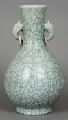 A Chinese celadon crackle glaze baluster vase With twin loop and ring handles. 44 cm high. CONDITION