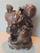 A Chinese carved hardwood group
Worked as various dogs-of-fo playing with a ball, standing on a