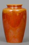 A Ruskin pottery vase
With orange lustre glaze, impressed mark Ruskin, England and dated 1927.  21