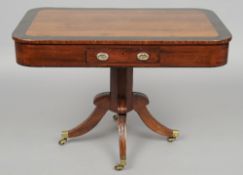 An early 19th century yewwood rent type table
The revolving crossbanded rounded rectangular top