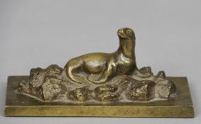 An early 20th century bronze animalier sculpture 
Formed as a sea lion on rocks, the plinth base