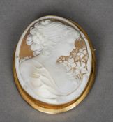 A gold framed cameo brooch
The shell carved with a young lady wearing a pearl necklace.  6 cm