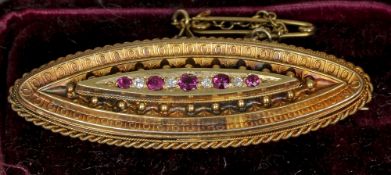 A Victorian diamond and ruby set sweetheart brooch
The verso with vacant glazed panel,