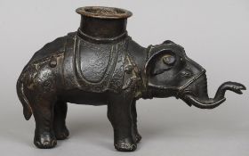 A 17th/18th century Chinese patinated bronze model of an elephant
Typically modelled wearing a