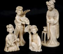 Four late 19th century Japanese ivory okimono 
Each formed as a geisha, two holding fans, one