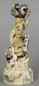 A Japanese carved ivory okimono
Formed and a Samurai on horseback, holding aloft a monkey, the