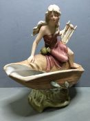 A Royal Dux porcelain centrepiece
Modelled as a lyre playing maiden surmounting a conch shell,