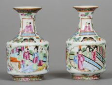 A pair of Chinese porcelain baluster vases
Each decorated with figural vignettes interspersed with