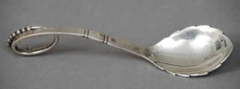 A Georg Jensen silver spoon
With a beaded scrolling handle and a leaf shaped bowl, stamped 925.