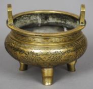 A small Chinese bronze censer
Of typical squat form, engraved with vignettes of blossoming sprays,