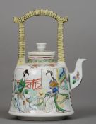 A Chinese Kangxi porcelain famille verte teapot The angular loop handle above the removable lid, the