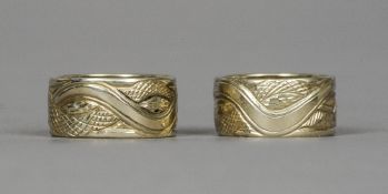 A pair of white gold diamond set rings by Alex Helin
Each worked with a serpent, both signed, one