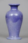 A Ruskin pottery baluster vase
With lilac lustre glaze, impressed mark Ruskin and dated 1912.  23.