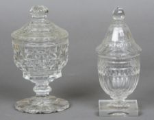 A 19th century cut glass pedestal bowl and cover 
With facet cut decoration above a short stem,