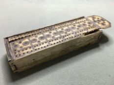 A Napoleonic period bone prisoner-of-war dominoes set
The box with cribbage board lid.  15 cm