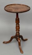 An 18th century burr elm topped tripod table
The dished circular top above the turned elm column,