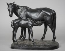 A late 19th/early 20th century cast iron animalier group
Formed as a mare feeding her foal,