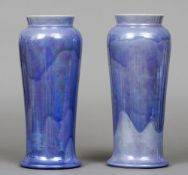 A pair of Ruskin pottery vases
Each of slender baluster form with lilac lustre glaze, impressed mark