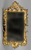 A 19th century rococo style giltwood wall mirror
The framed surmounted with a pierced crest and