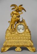 A 19th century gilt bronze mantel clock
Surmounted with a musician.  46 cm high. CONDITION