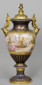 A large Vienna porcelain urn form vase
With ormolu mounted handles, the main body painted with