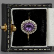 An 18 ct gold, diamond, amethyst cluster ring
 CONDITION REPORTS: Overall good, some inclusions,