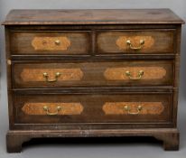 A 19th century walnut chest of drawers
The cross and feather banded moulded rectangular top above