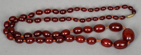 A cherry amber bead necklace Approximately 96 cm long. CONDITION REPORTS: Overall good, some general