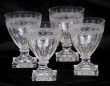 A set of four 19th century clear glass rummers
Each with etched and faceted decoration,