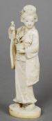 A late 19th century Tokyo School carved ivory okimono
Modelled as a woman in flowing gowns,