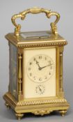 A 19th century gilt brass cased grand sonnerie carriage clock
The ivory dial with Arabic numerals