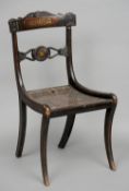 A set of six Regency brass inlaid chairs
Each with ornately brass inlaid bar backs above cane seats