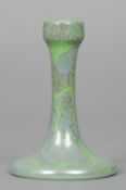 A Ruskin pottery candlestick
With mottled lustre glaze, impressed mark Ruskin, England and dated