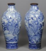 A pair of large 19th century Chinese blue and white vases
Decorated in the round with courtly