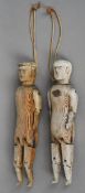 A pair of Folk Art peg dolls
Each a male figure, one wearing a flat cap.  The largest 32.5 cm high.