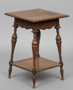 A Howard & Son oak side table
The square top above the shaped frieze,