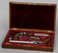 A fine quality cased pair of reproduction duelling pistols
The barrels with engraved decoration,